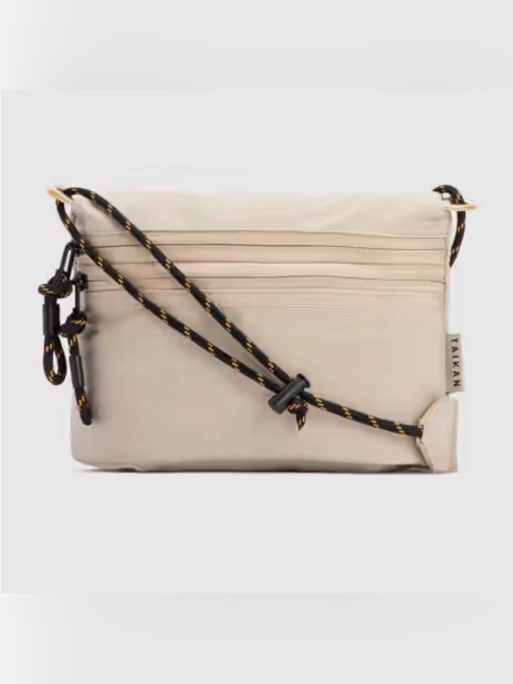Urban Outfitters Beige Crossbody Bag with Black Cord Strap